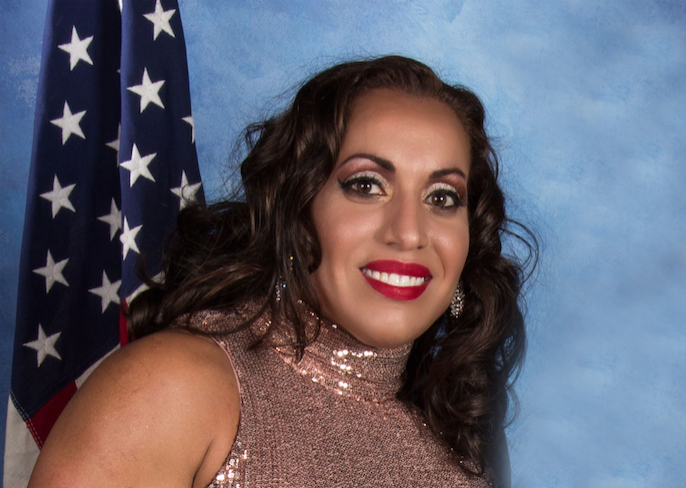 portrait of woman in front of flag